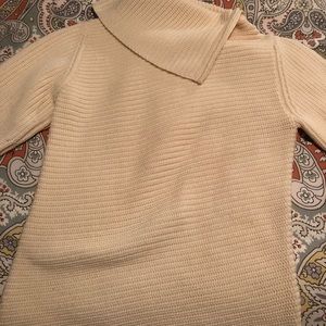 Banana Republic beige turtleneck sweater.